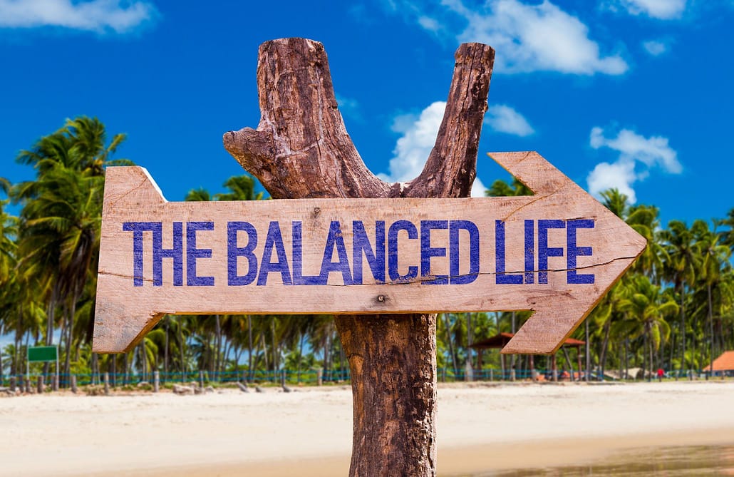 The Balance Life arrow with beach background